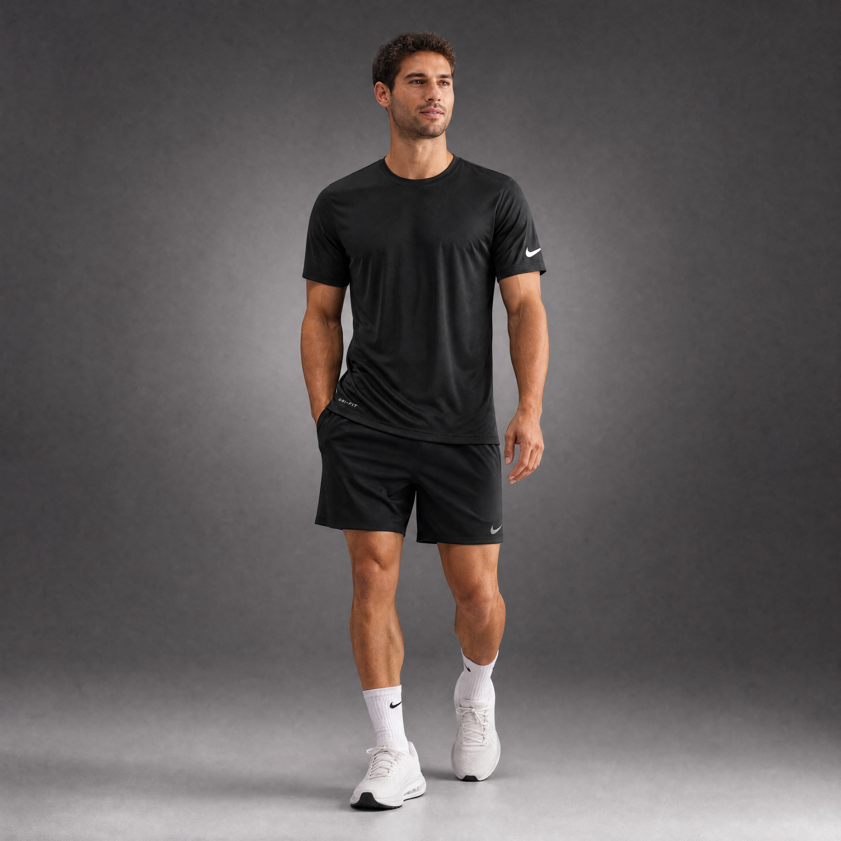 Male athlete modeling the black Nike Cotton Short Sleeve Men's Tee