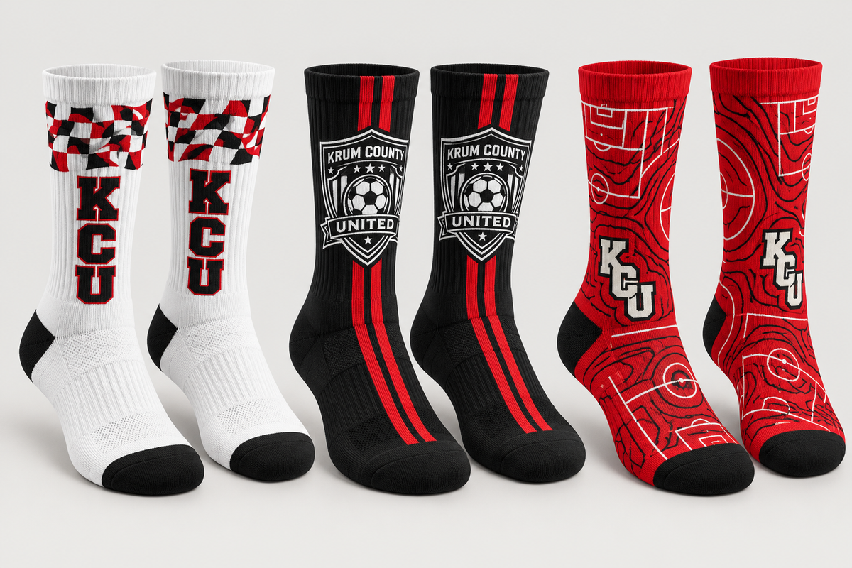Three pairs of Krum crew socks in red, white, and black with stripes, checker cuffs, and club marks