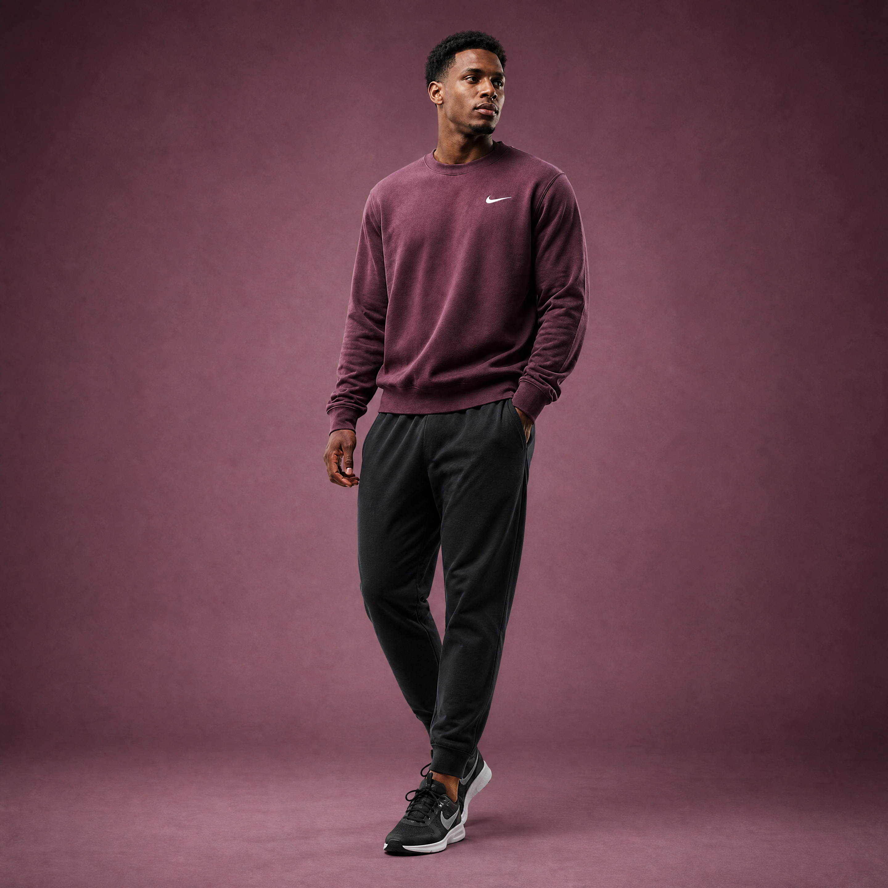 Male athlete modeling the maroon FCTR Apparel Nike Men's Club Fleece Crew