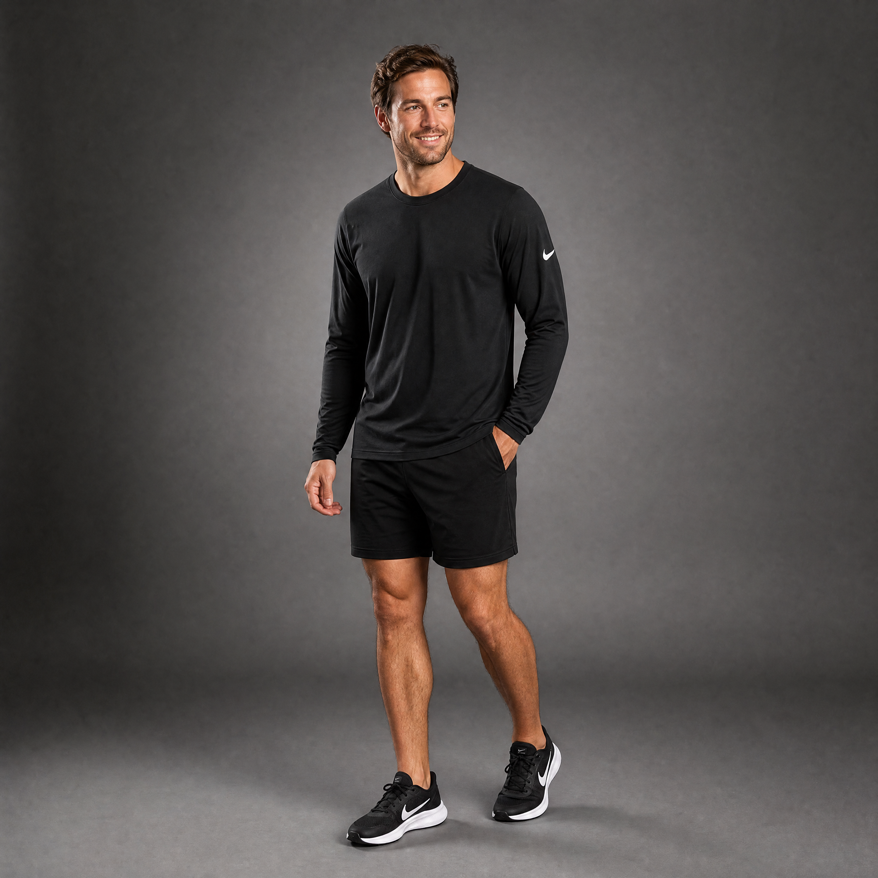 Male athlete modeling the black Nike Cotton Long Sleeve Men's Tee