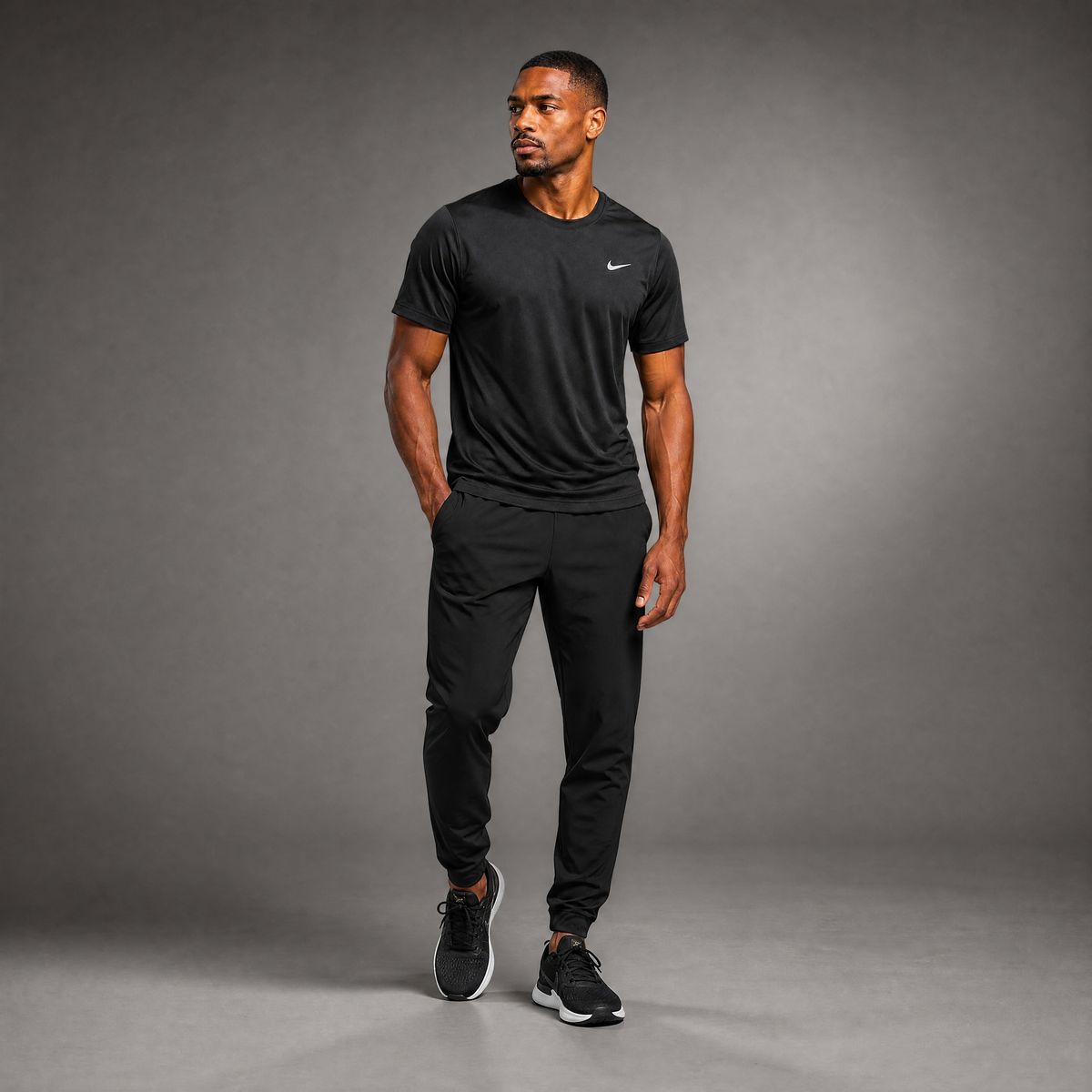 Male athlete modeling the black Nike Short Sleeve Dri-FIT Athletic Shirt