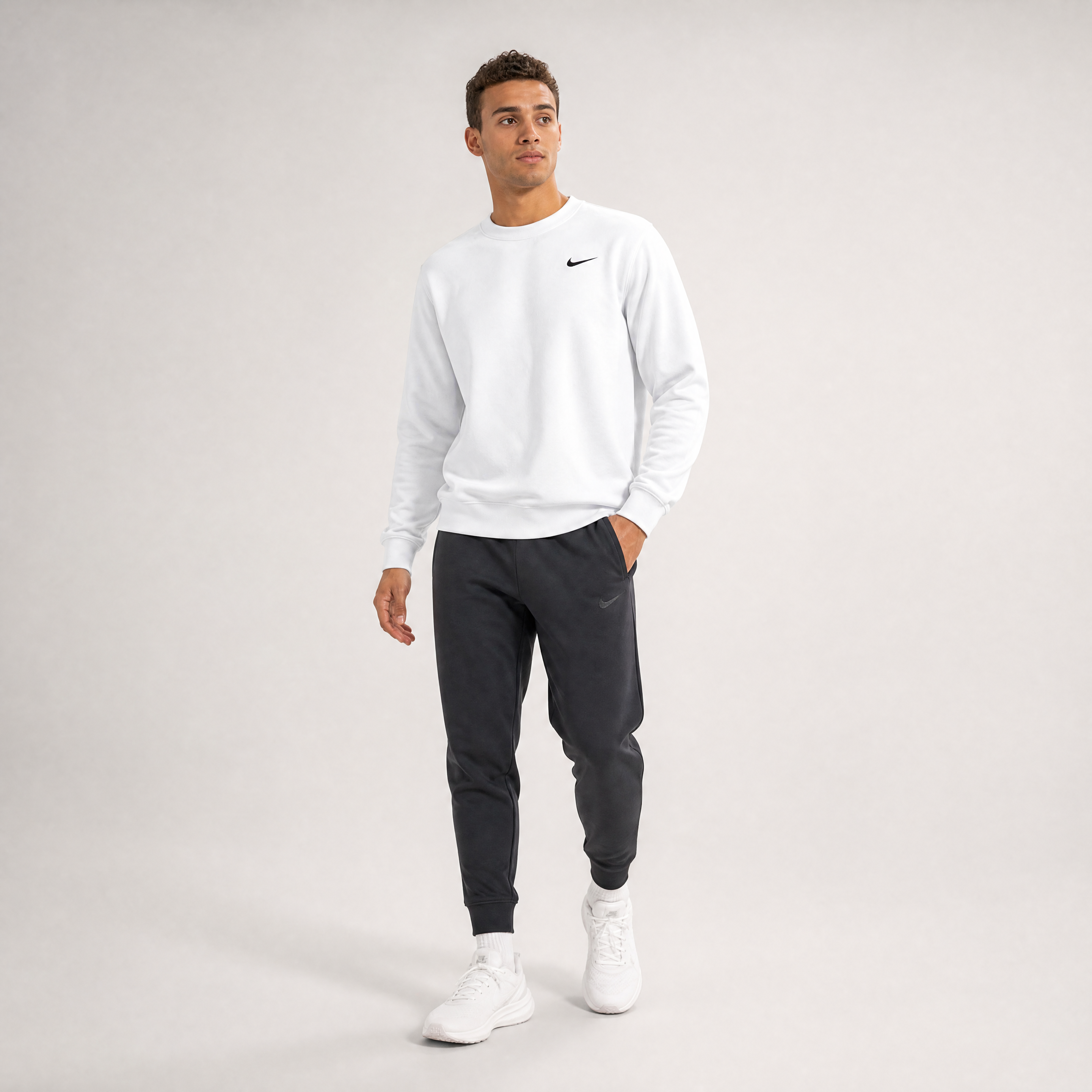 Male athlete modeling the white FCTR Apparel Nike Men's Club Fleece Crew
