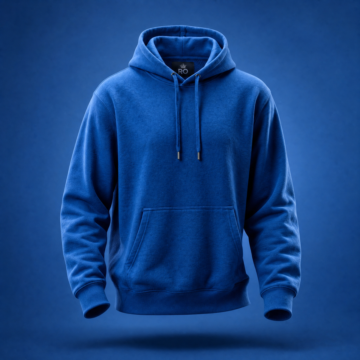 A royal blue pullover hoodie with drawstrings and a front kangaroo pocket, shown floating against a matching blue gradient background.