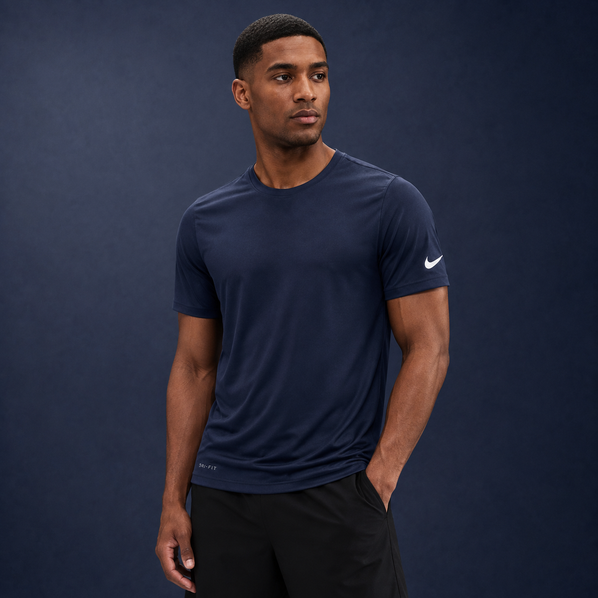 Athletic model wearing the Nike Cotton Short Sleeve Men's Tee