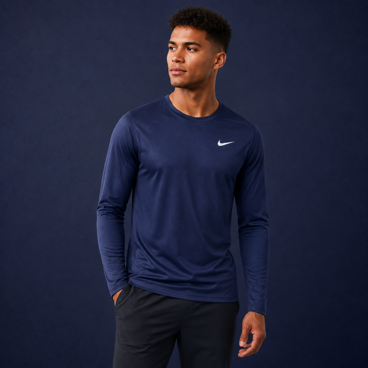 Athletic model wearing the Nike Long Sleeve Dri-Fit Athletic Shirt