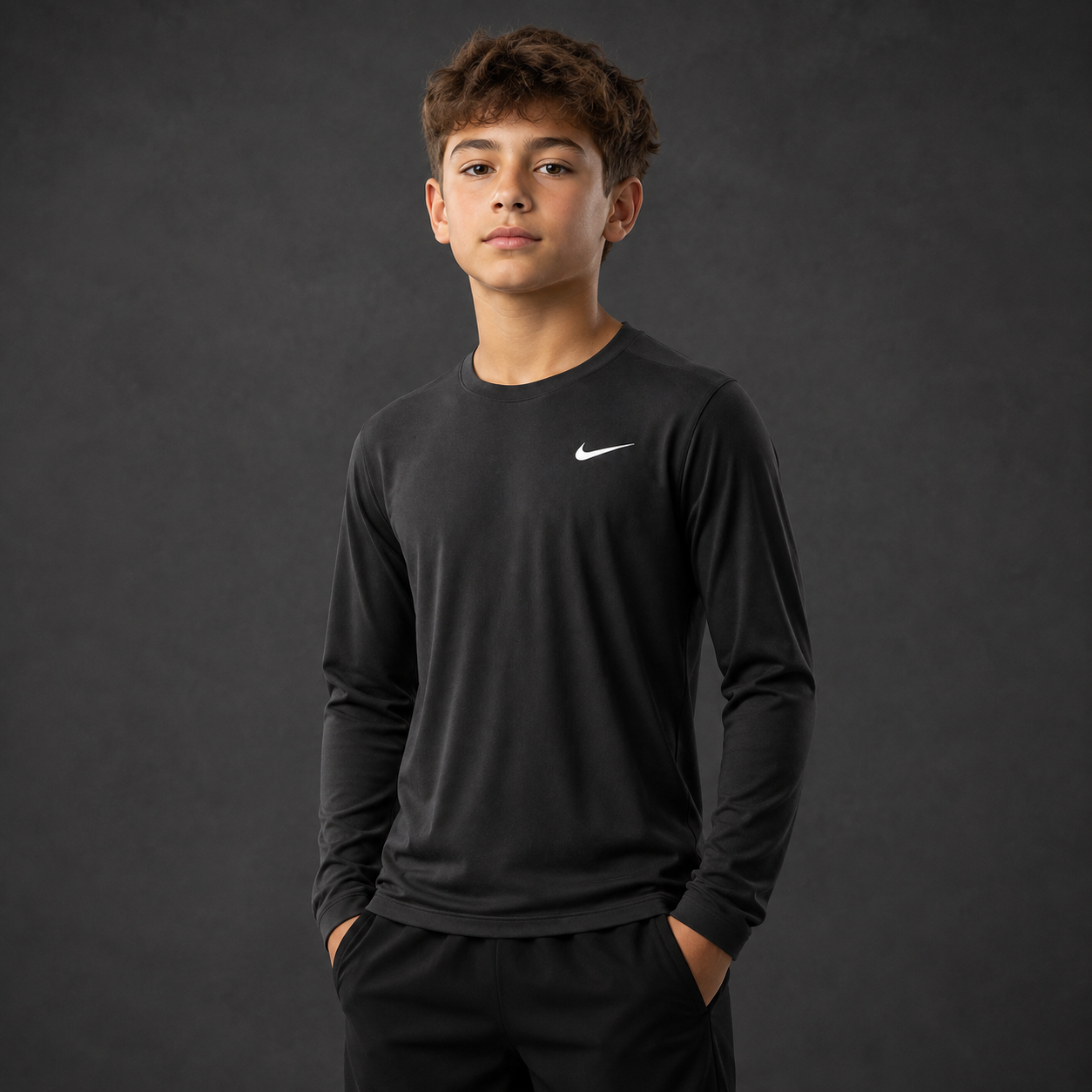 Youth athlete wearing the Nike Youth Dri-Fit Long Sleeve Shirt